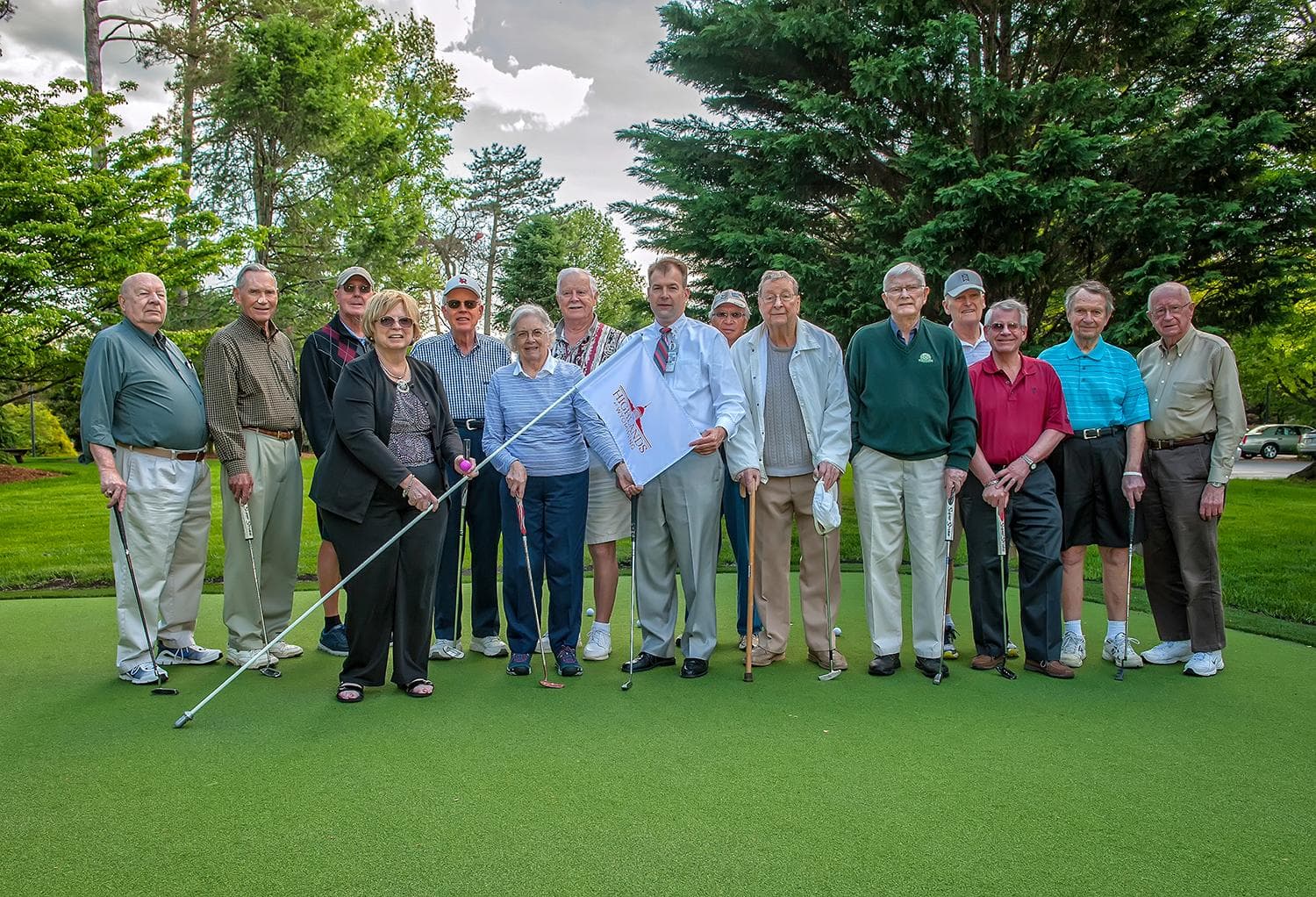Team and residents at putting green