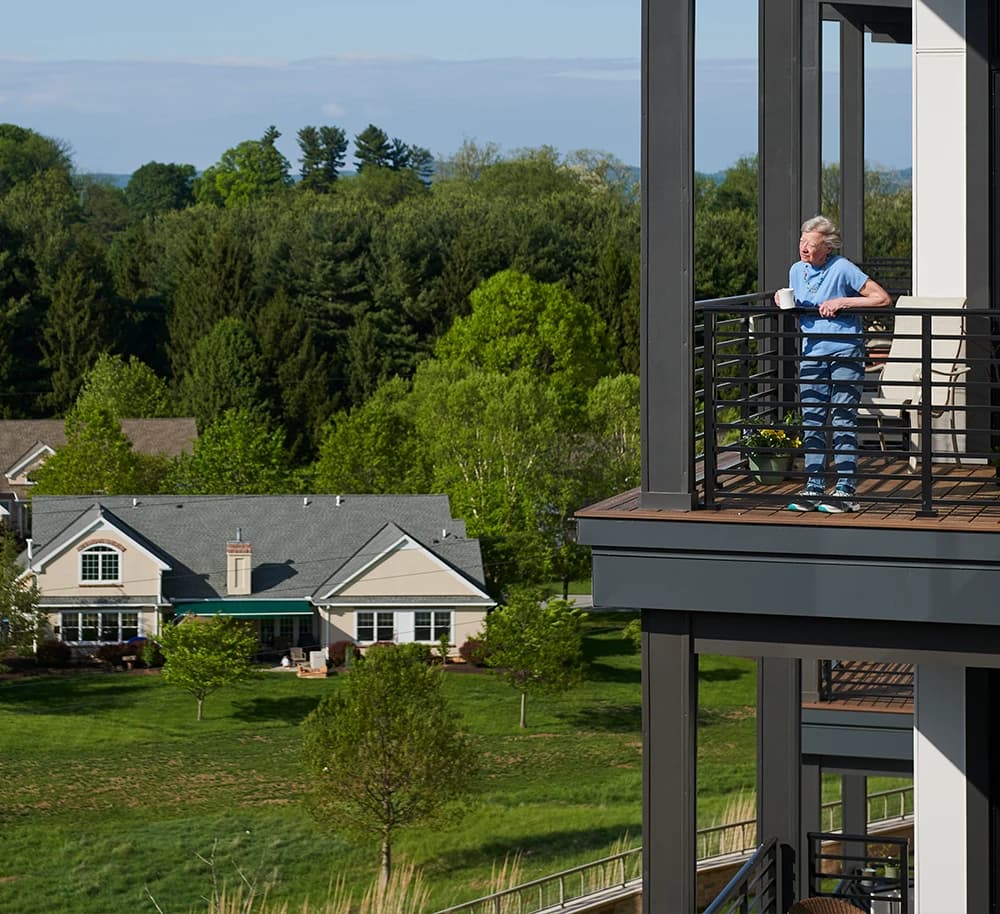 Woman on deck drinking coffee