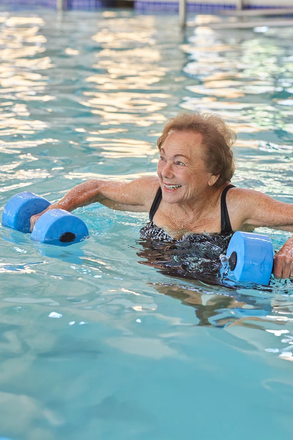 Woman participating in pool fitness