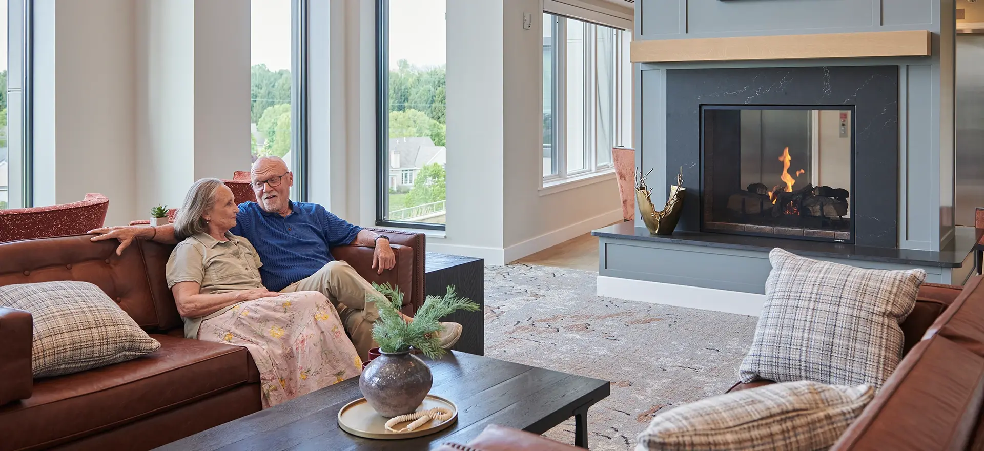 Man and woman sitting on couch