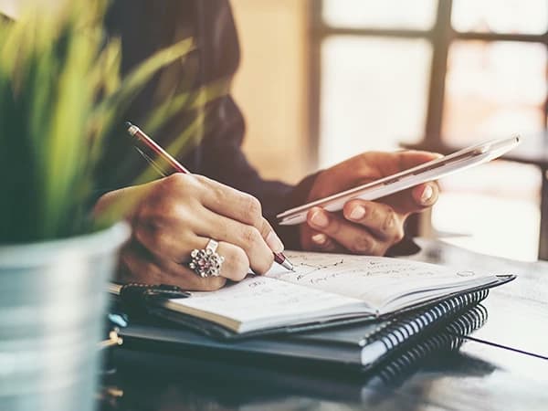Woman taking notes