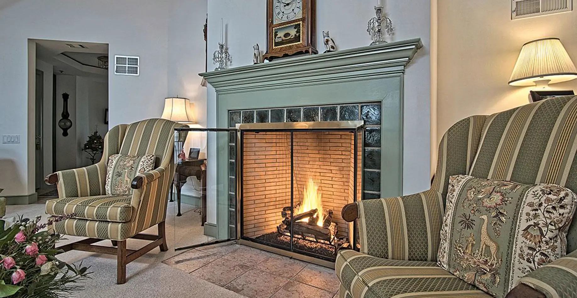 Chairs next to a fire place