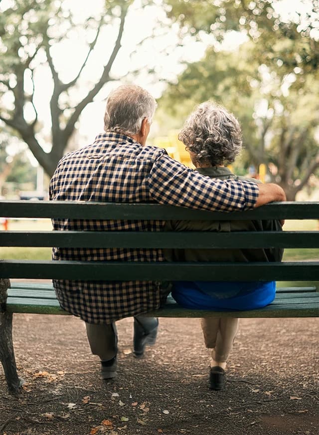 Man and woman sitting on a bench